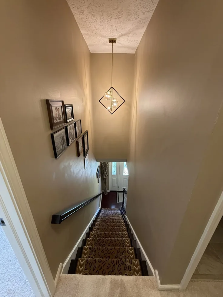 Pendant light installed in a two-story stairwell